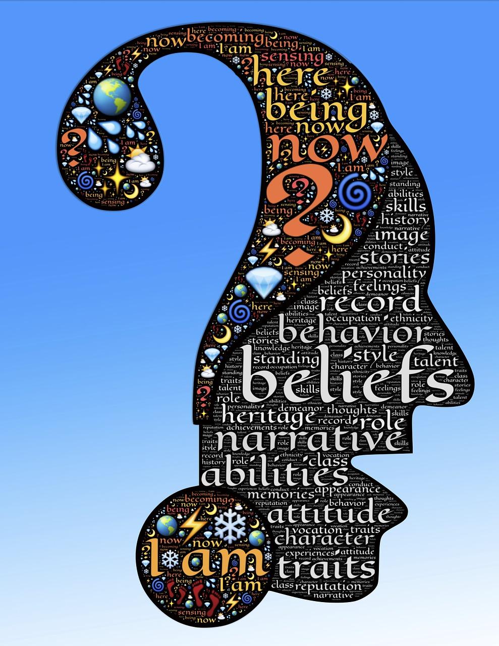 The image is an artistic representation of a human head silhouette filled with various words and symbols. The silhouette is shaped like a question mark, symbolizing inquiry or self-reflection. The background is a gradient of blue, transitioning from a darker shade at the top to a lighter one at the bottom. Inside the silhouette, words such as 'beliefs', 'heritage', 'narrative', 'abilities', 'attitude', and 'traits' are prominently displayed, suggesting themes of identity and self-discovery. The words are interspersed with colorful symbols like planets, stars, and abstract shapes, adding a whimsical and thought-provoking element to the design. The text is primarily in English.