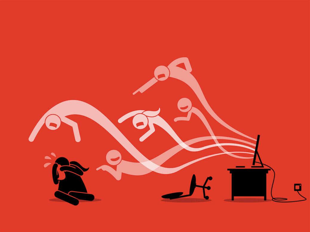 The image is an illustration with a red background depicting a scene of online harassment. On the right side, there is a computer on a desk with a chair knocked over. From the computer screen, several ghostly figures are emerging, appearing to be shouting or pointing aggressively. These figures are directed towards a person sitting on the ground on the left side, who is depicted in black and appears to be covering their face in distress. The illustration conveys a sense of cyberbullying or online abuse.