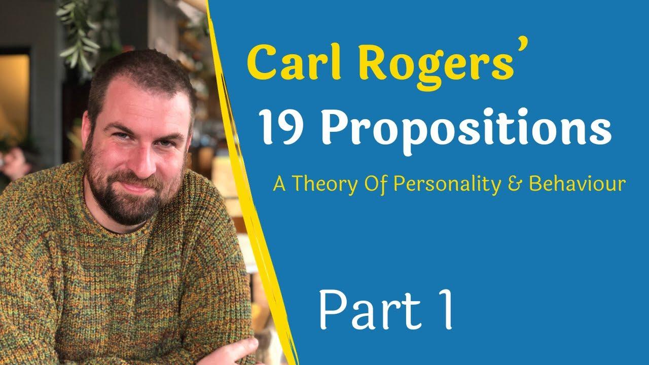 The image features a man with a beard and a colorful sweater sitting in a relaxed pose. The background appears to be a cozy indoor setting with plants and warm lighting. On the right side of the image, there is a blue section with text in yellow and white. The text reads: 'Carl Rogers’ 19 Propositions A Theory Of Personality & Behaviour Part 1.' The design suggests an educational or informational theme, likely related to psychology.